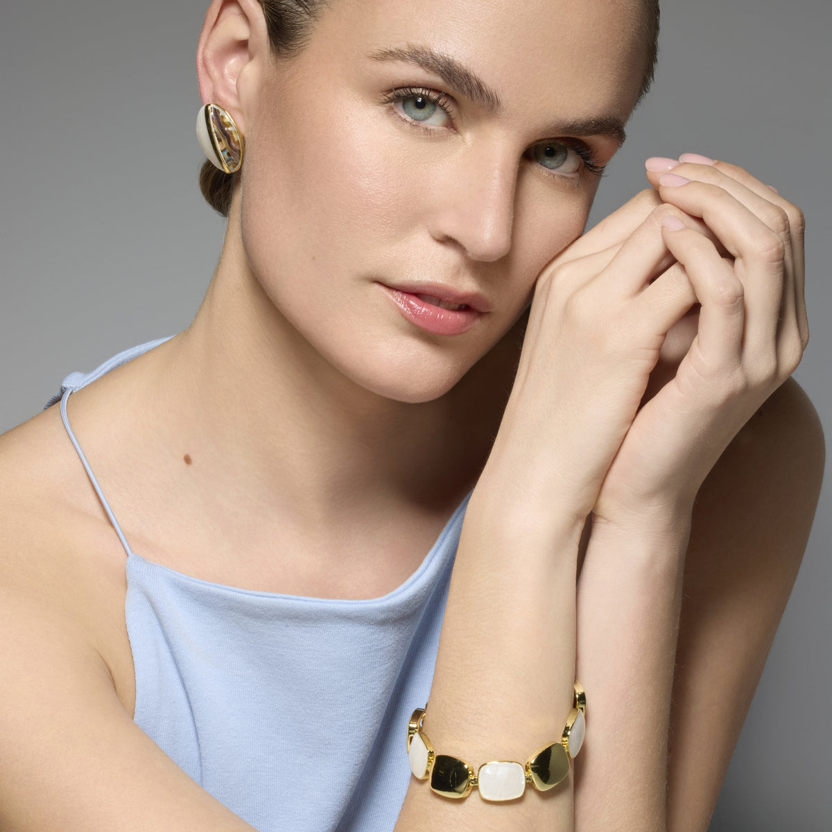 Thisca White Mother of Pearl Earrings in 18k Yellow Gold Finish