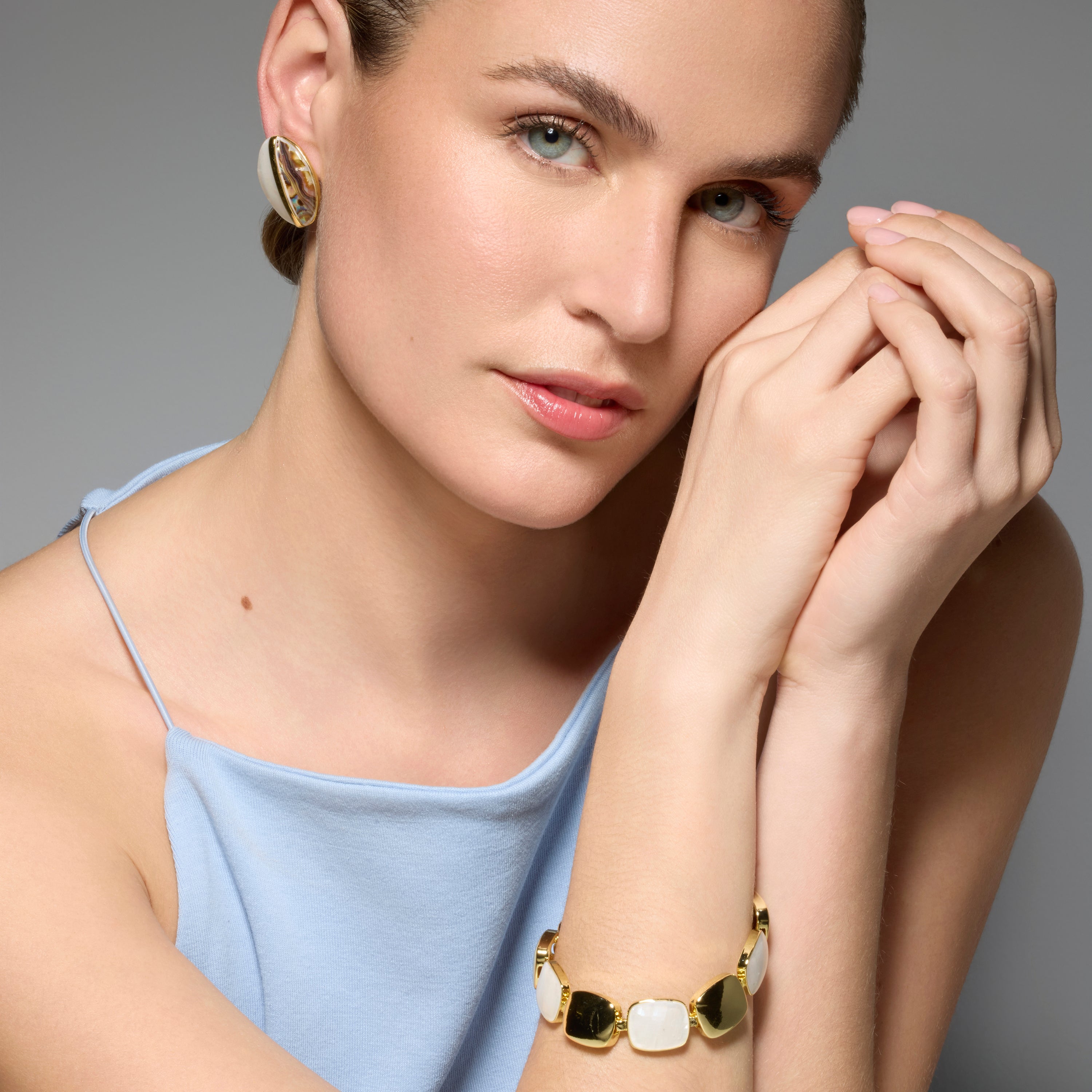 Thisca White Mother of Pearl Earrings in 18k Yellow Gold Finish